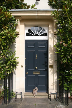 On Georgian front doors the openings are plain and have deep double-hung sash windows