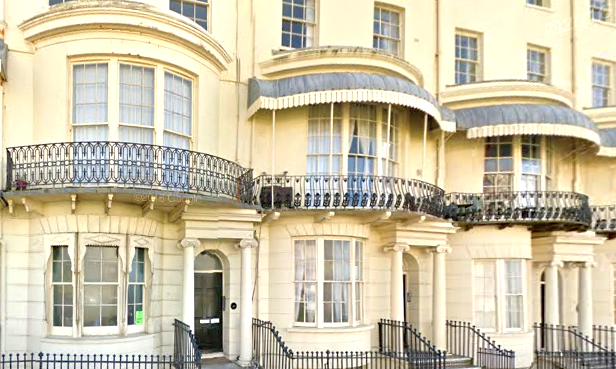 Close up of a row of Regency balconies which are of extremely fine and delicate ironwork,